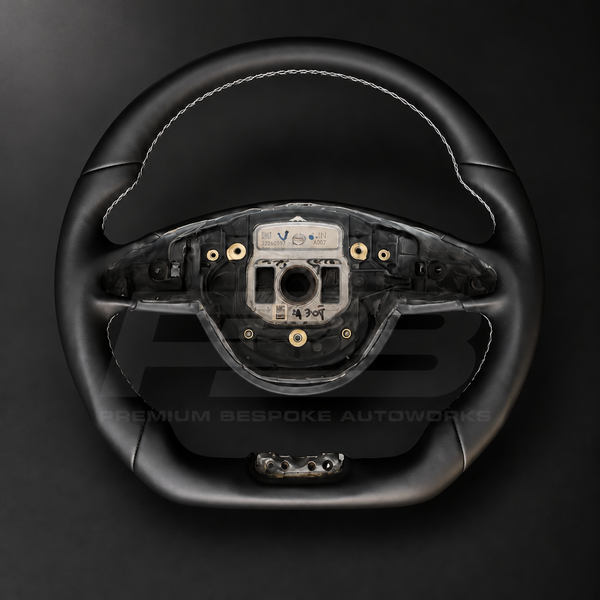 Mercedes-AMG S63 W222 custom steering wheel front view showing flat bottom, smooth black leather and white stitching