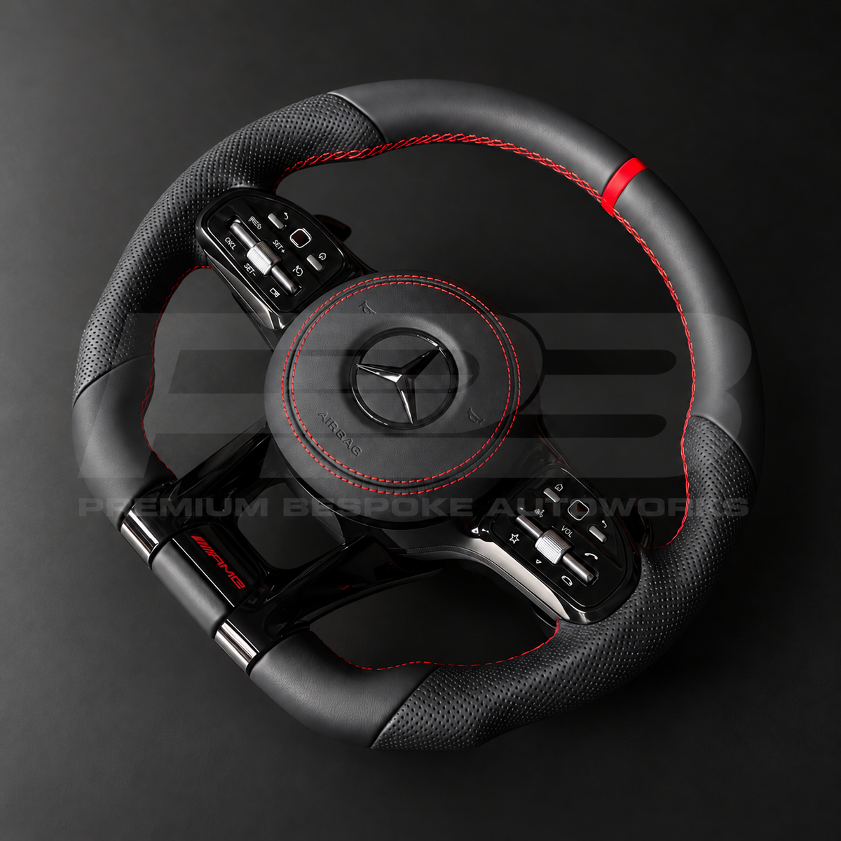 Mercedes-AMG C43 W205 facelift custom steering wheel rotated to show the perforated black leather grips, red stitching and gloss black paddle shifters