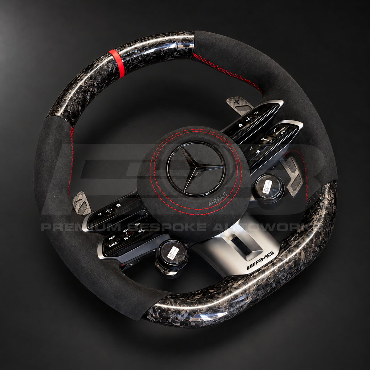 Mercedes-AMG CLA 45 S custom steering wheel rotated to show the black Alcantara grips with red stitching, forged carbon top section and AMG touch controls
