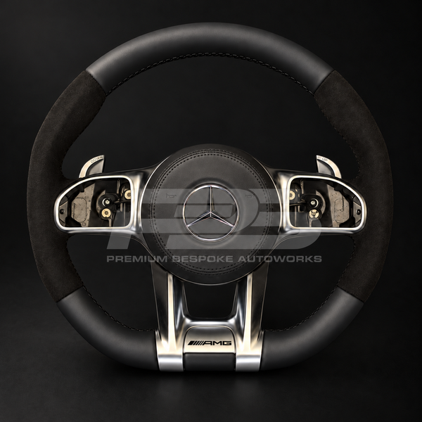 Mercedes-AMG GLE V167 custom steering wheel, front view, flat bottom with smooth black leather top and bottom, black Alcantara grips, black stitching and factory silver AMG trims, built by Premium Bespoke AutoWorks