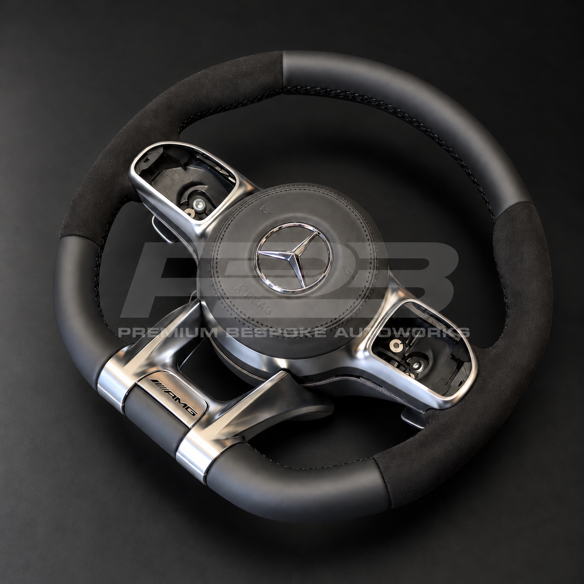 Mercedes-AMG GLE V167 custom steering wheel rotated to show the flat bottom section in smooth black leather and the silver AMG lower spoke