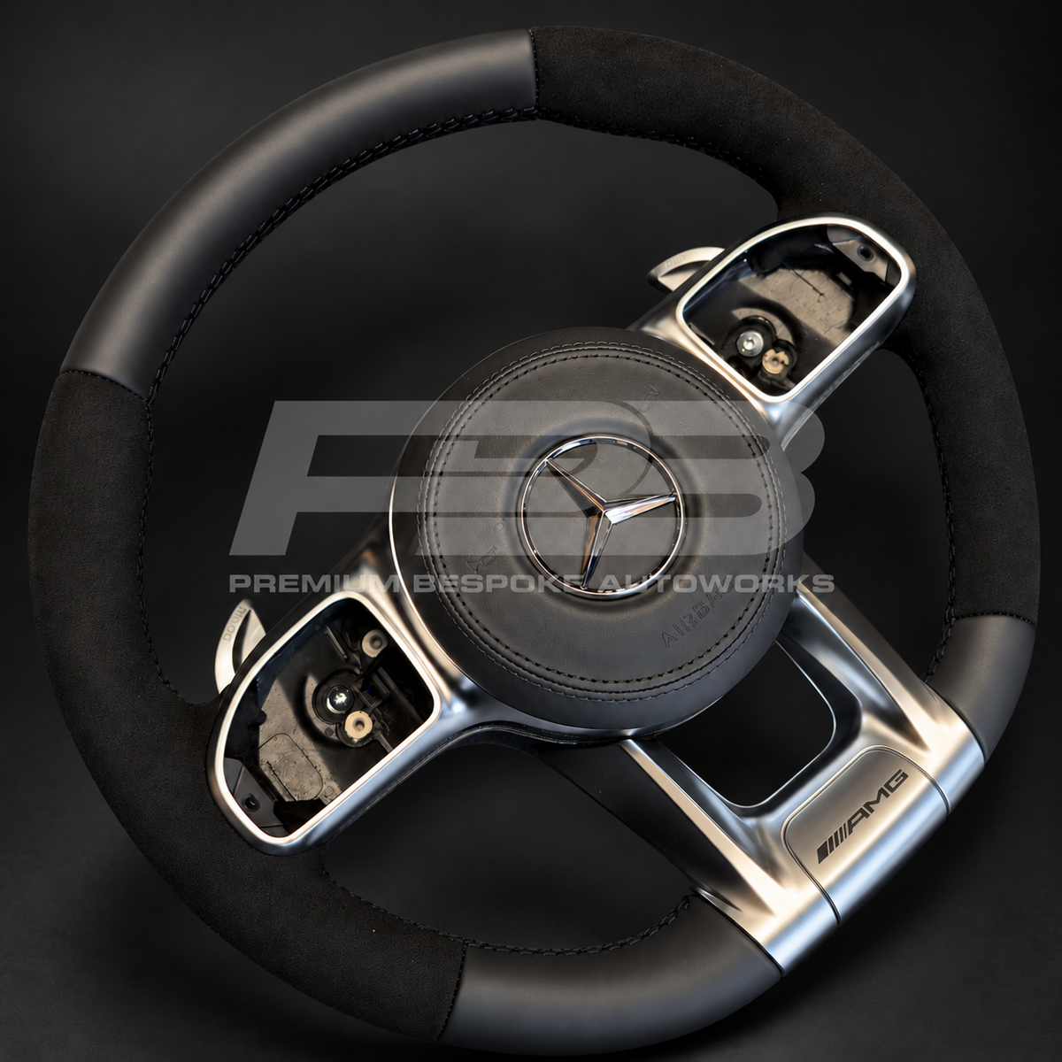Mercedes-AMG GLE V167 custom steering wheel, side angle showing the Alcantara grip, leather bottom section and silver AMG trims