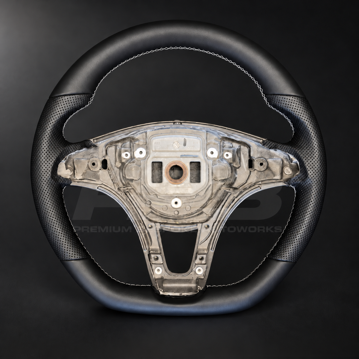 Mercedes X-Class custom steering wheel front view showing flat bottom, black smooth leather top and bottom, black perforated leather grips and light grey stitching