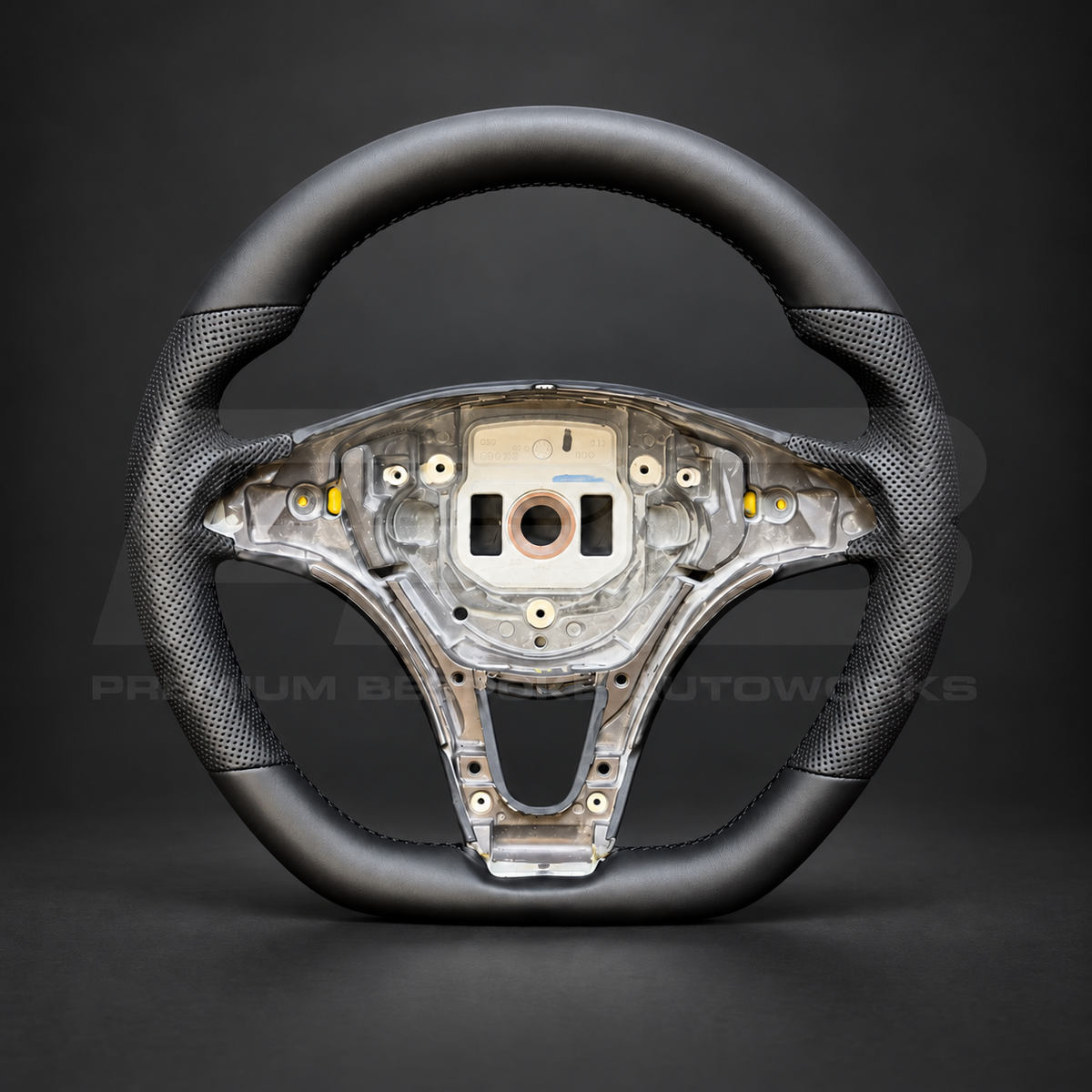 Mercedes X-Class custom steering wheel front view showing flat bottom, smooth black leather and black perforated leather grips