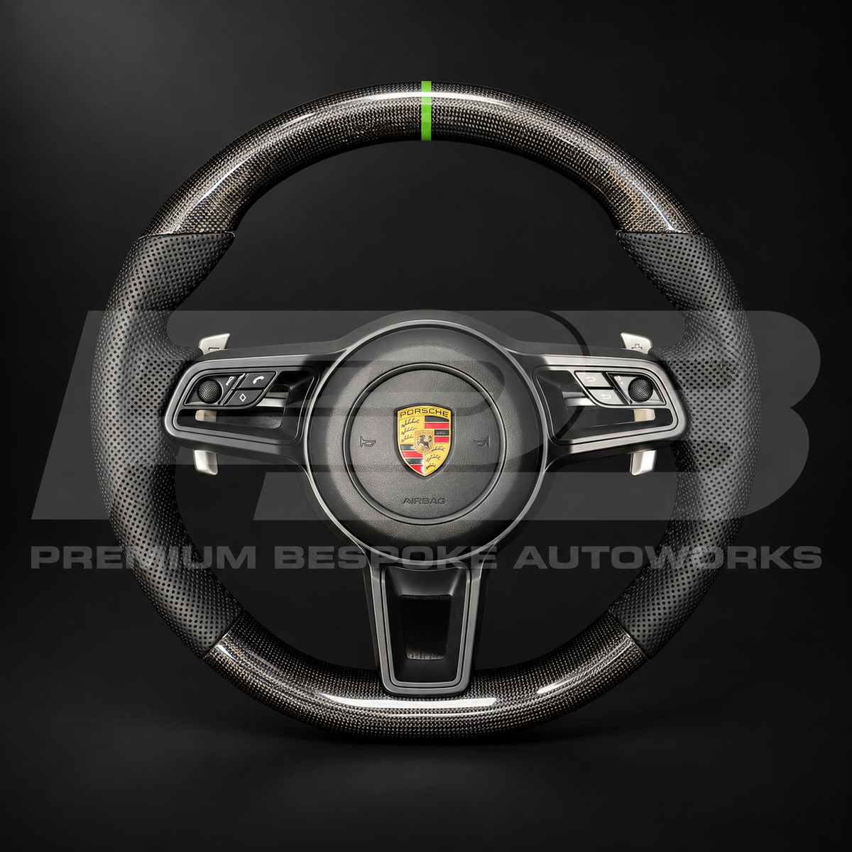 Porsche 911 991.2 custom steering wheel, front view: gloss carbon fibre top and bottom, perforated black leather grips, green 12 o'clock marker, gloss black trims and paddle shifters