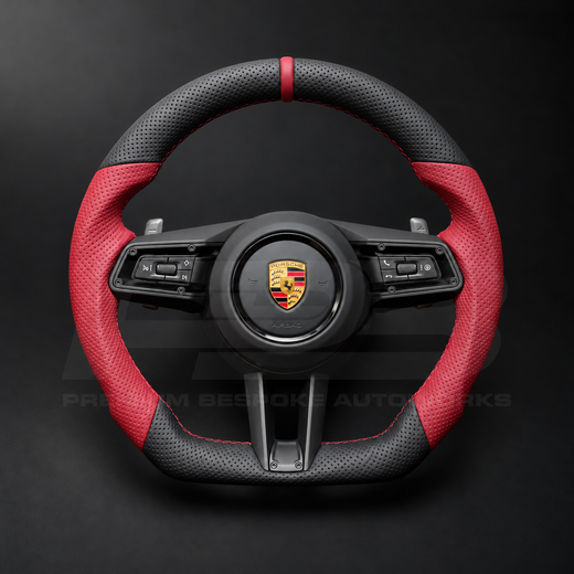 Porsche 911 992 custom steering wheel front view, flat bottom, perforated black leather, red perforated grips, red stitching and red 12 o'clock marker