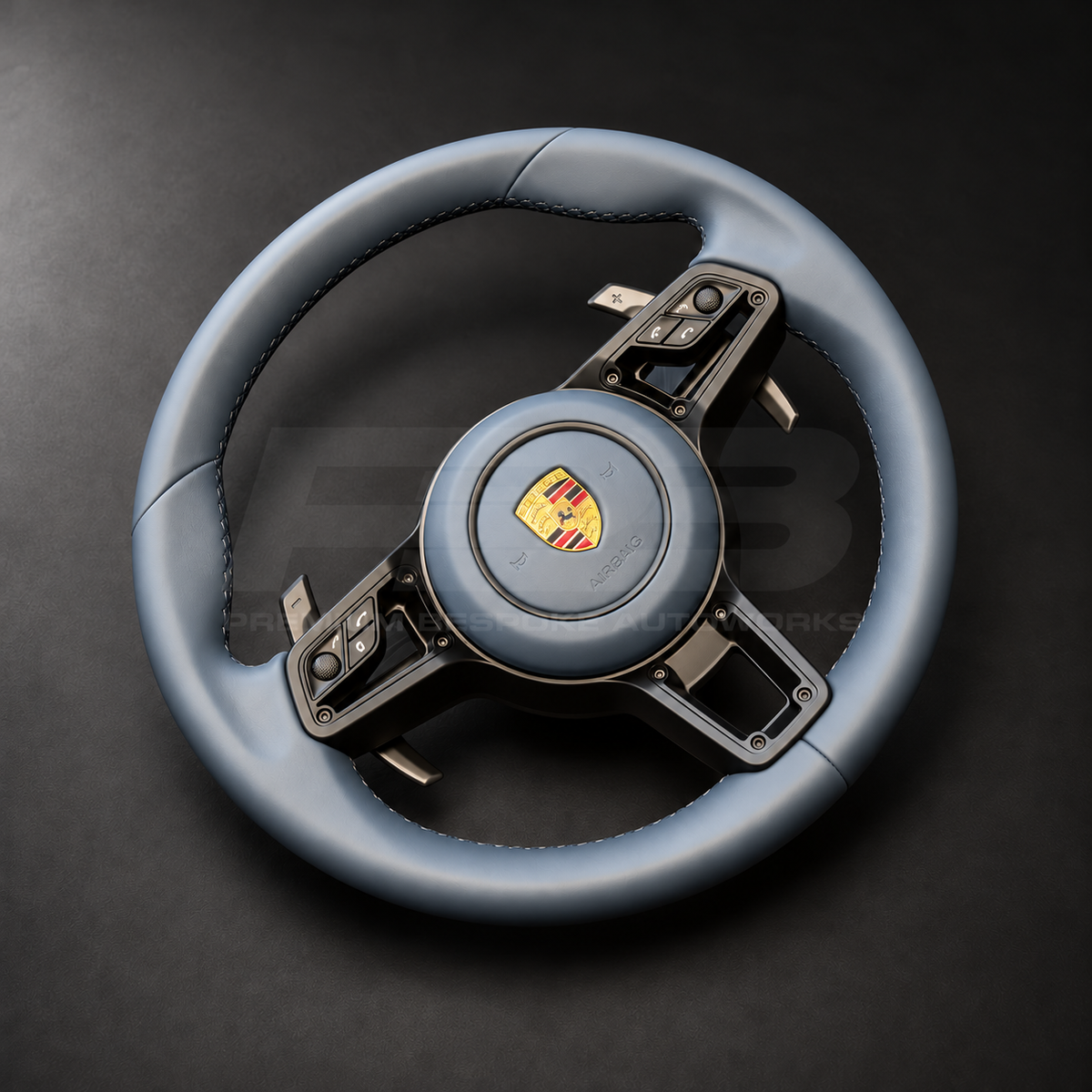 Porsche 911 997 steering wheel upgrade right angle showing a 991.2 wheel in full blue leather with matching blue leather airbag cover and silver paddles