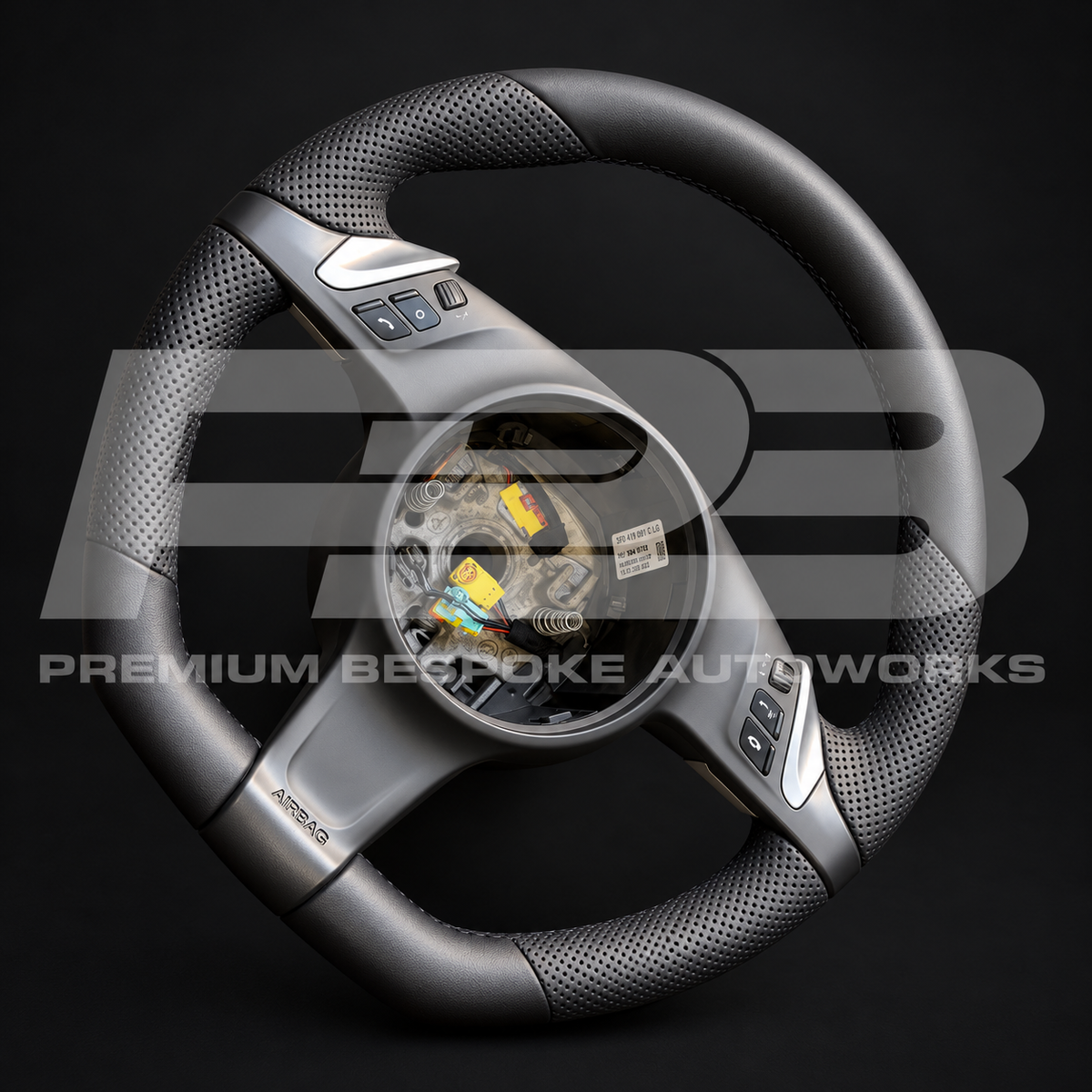 Porsche Panamera 970 flat bottom custom steering wheel at an angle, black leather, perforated grips, new multi-function buttons and paddles