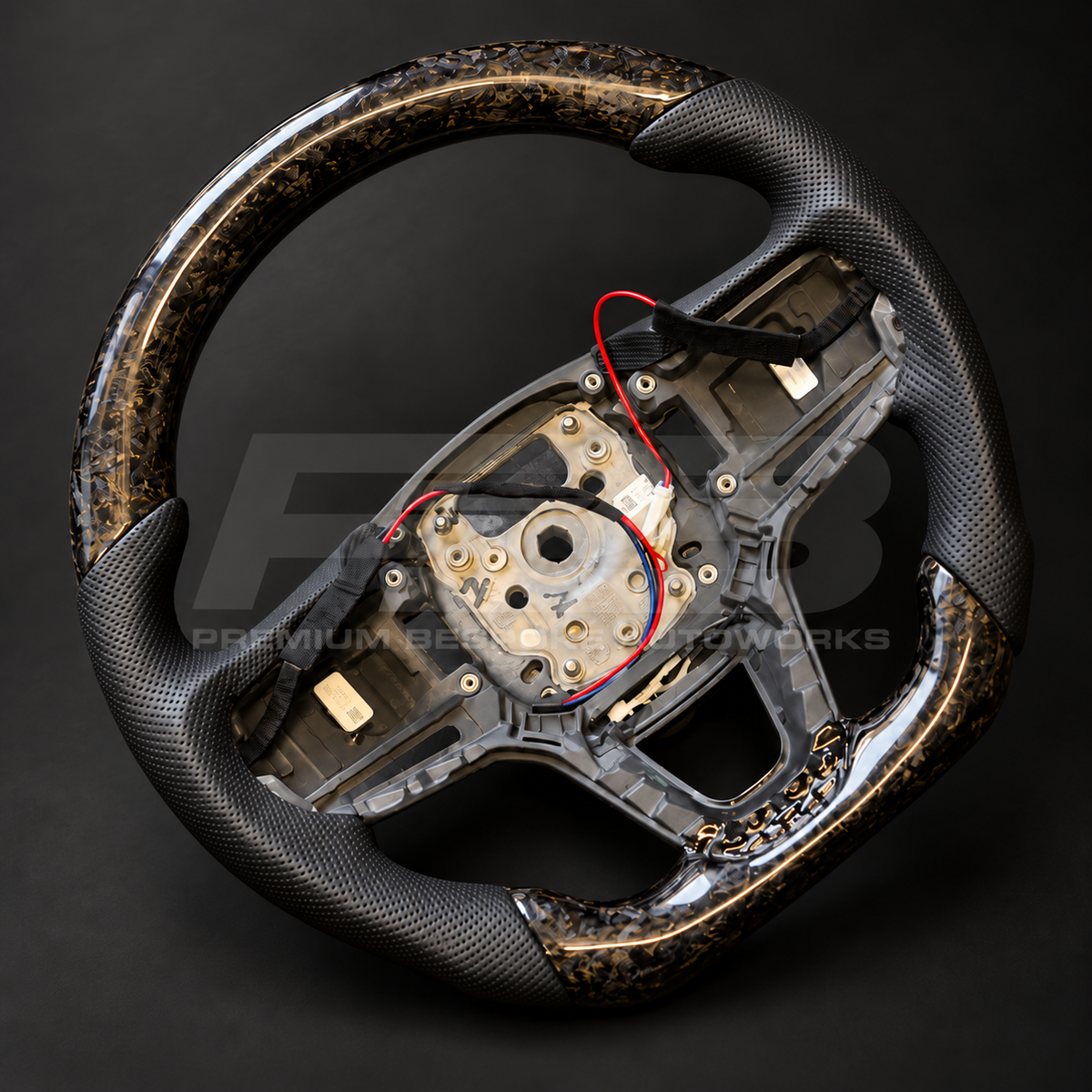 Range Rover Sport L461 custom steering wheel rotated to show the gloss forged carbon top section and perforated leather grips