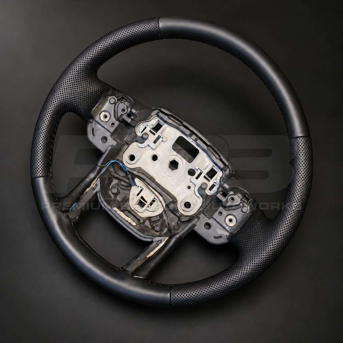 Range Rover Sport L494 custom steering wheel rotated to show the smooth black leather bottom section and lower spokes