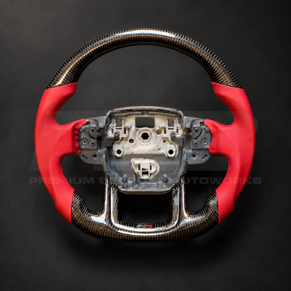 Range Rover Sport L494 SVR custom steering wheel front view, flat bottom, gloss carbon fibre top and bottom, SVR red leather grips and stitching, carbon lower trim with SVR badge